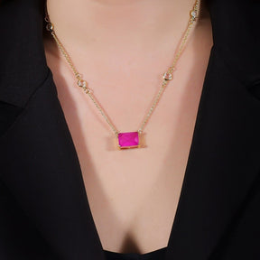 Golden Necklace with Pink Rectangles and Points of Light